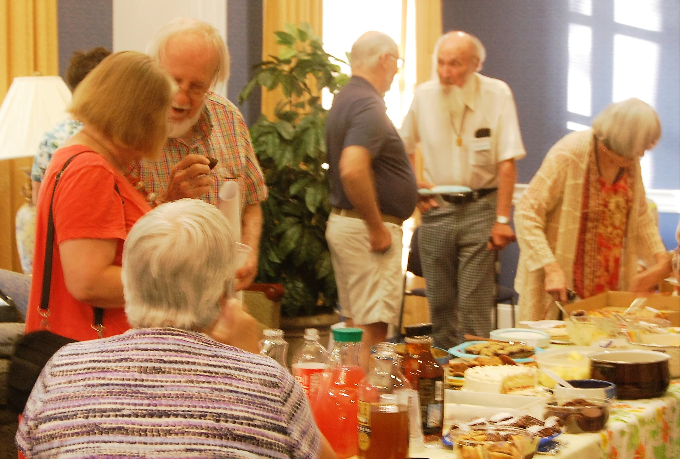 Members and guests mingle over snacks at the annual fall open house.