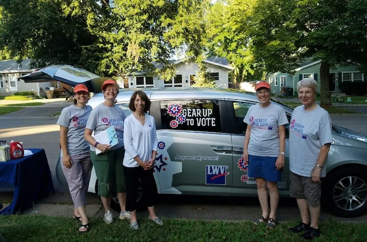 State League staff stayed at the Gear Up to Vote van. They offered snacks and information to passersby. 