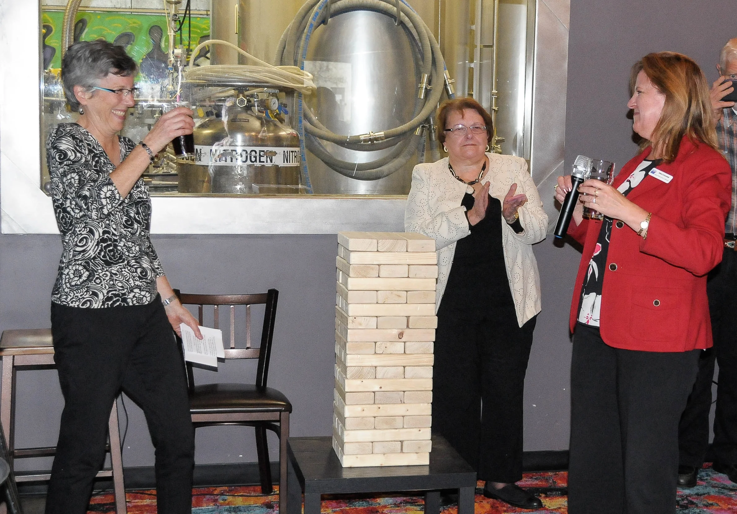 LWVWI Executive Director Andrea Kaminski raises a glass to Debra Cronmiller, LWVWI President, and Melanie Ramey, past President, at her retirement party, October, 2017