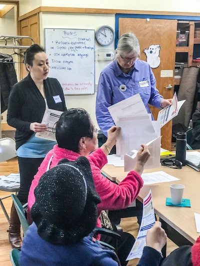 Translator Yimmuaj Yang interprets for the residents.