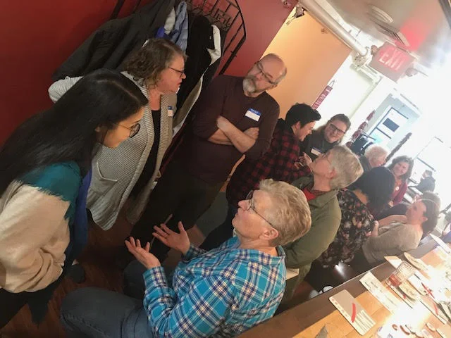 More than a dozen members gathered for tasty mo-mos and beverages of all kinds.