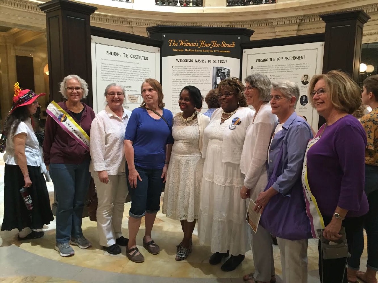  League and Delta Sigma Theta members gather in the rotunda to celebrate woman suffrage! 