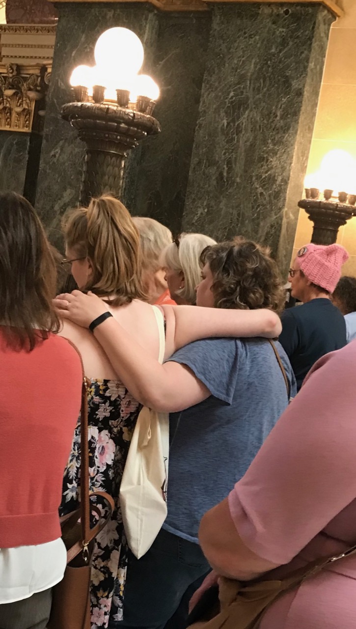  A mother and daughter share a moment during the ceremony. 