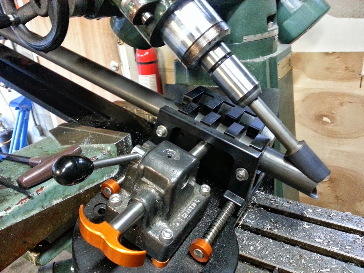 The miter angle is so steep I had use a longer hole saw arbor to clear the jig.