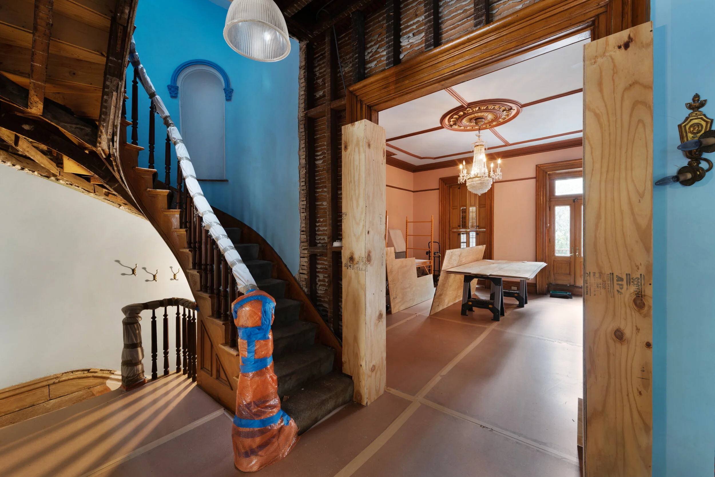The home features a delicately curved mahogany bannister and stairs.