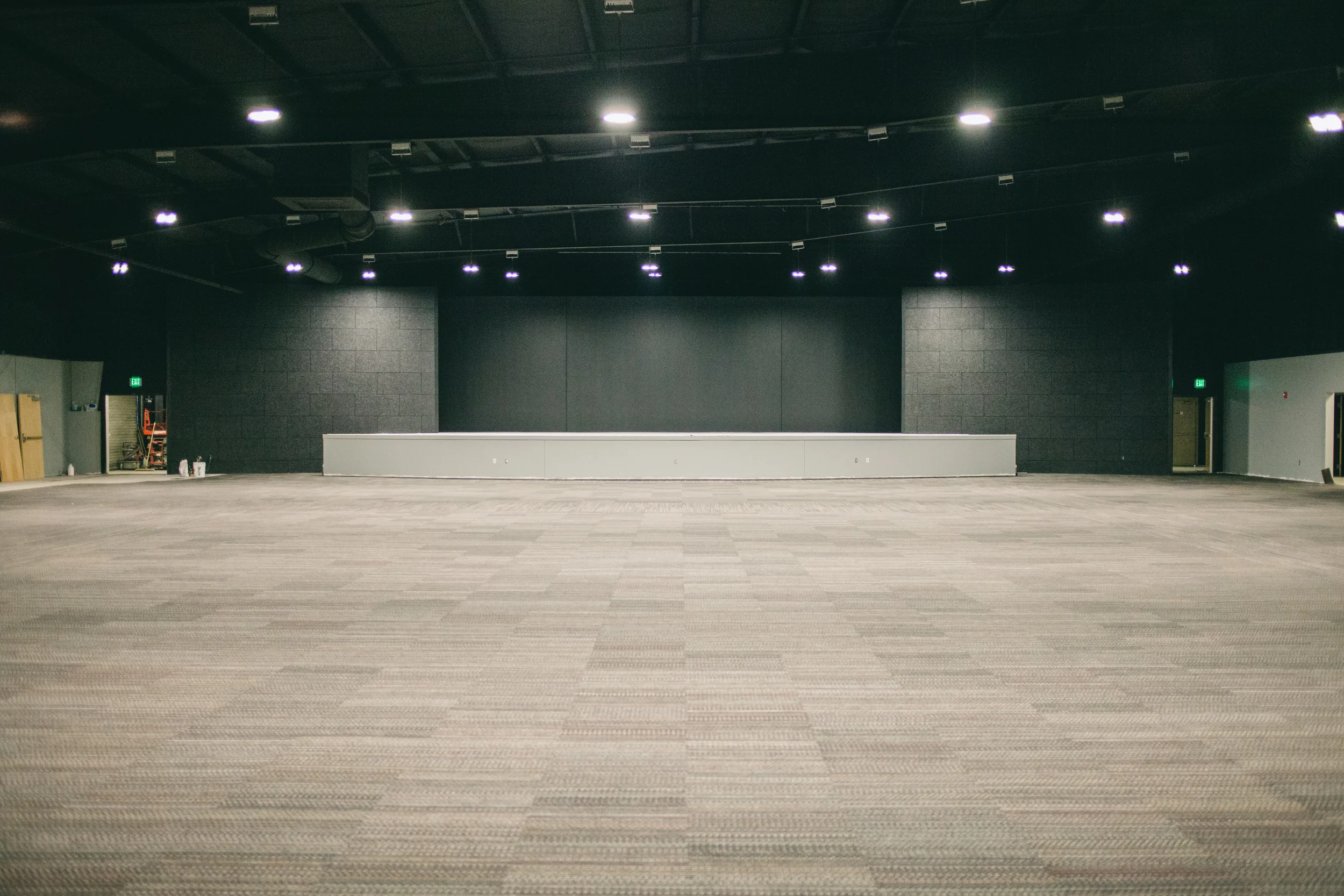 Inside view of auditorium, with stage complete and carpet installed