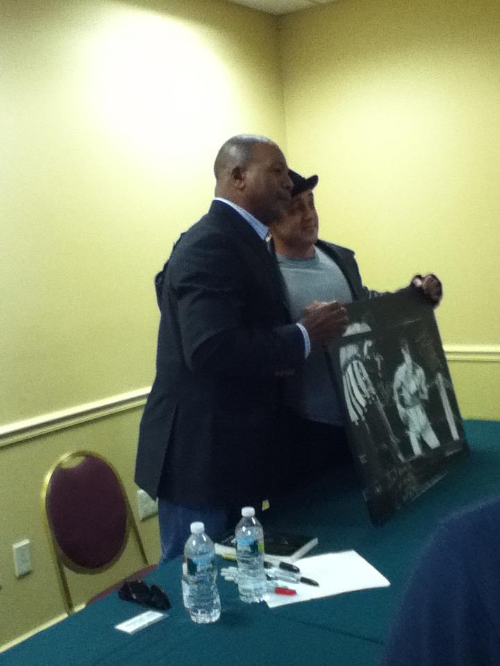 My book (on the table) for The Champ, Apollo Cre-, I mean, the actor, Carl Weathers! (He also signed this picture, "Ain't Gonna be No Rematch' I did of him and Stallone. He's upset I only painted his back side.)