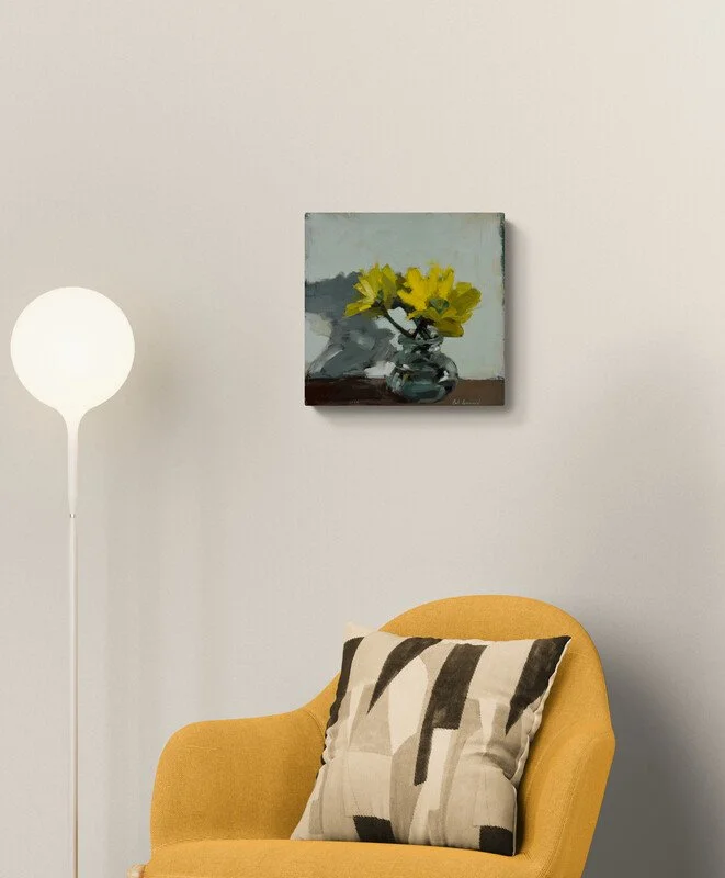 comfy-chair-next-to-a-tall-cabinet-and-lamp.jpg