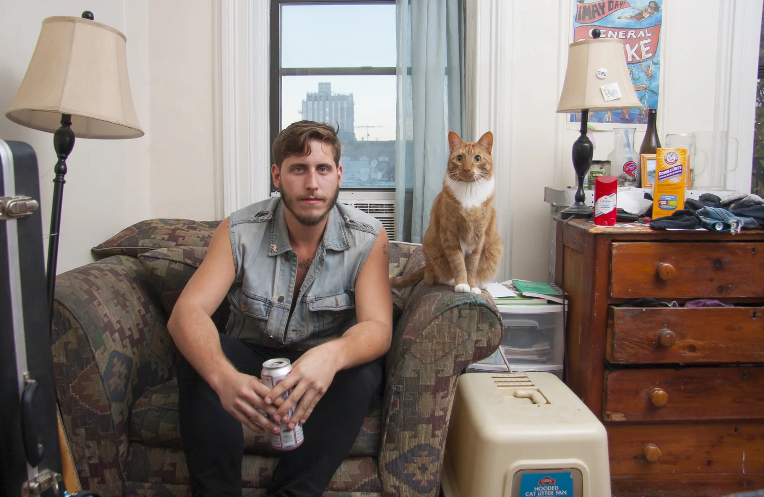 Josh enjoying a beer in the company of his cat Lucero