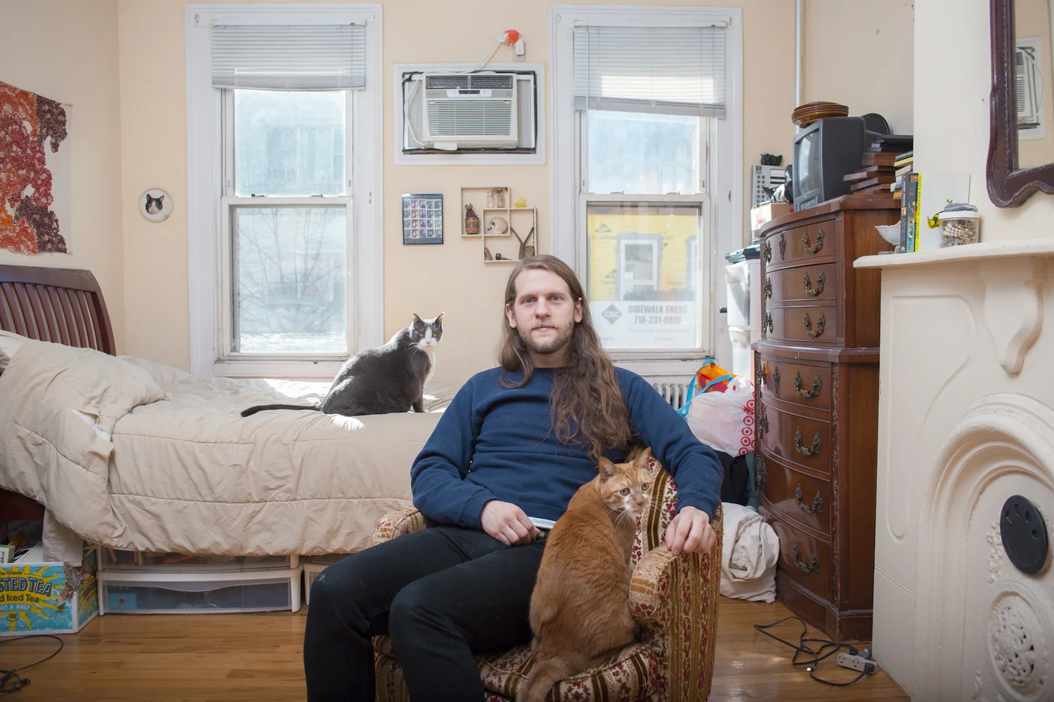 Eric in his bedroom with Pup and Bean