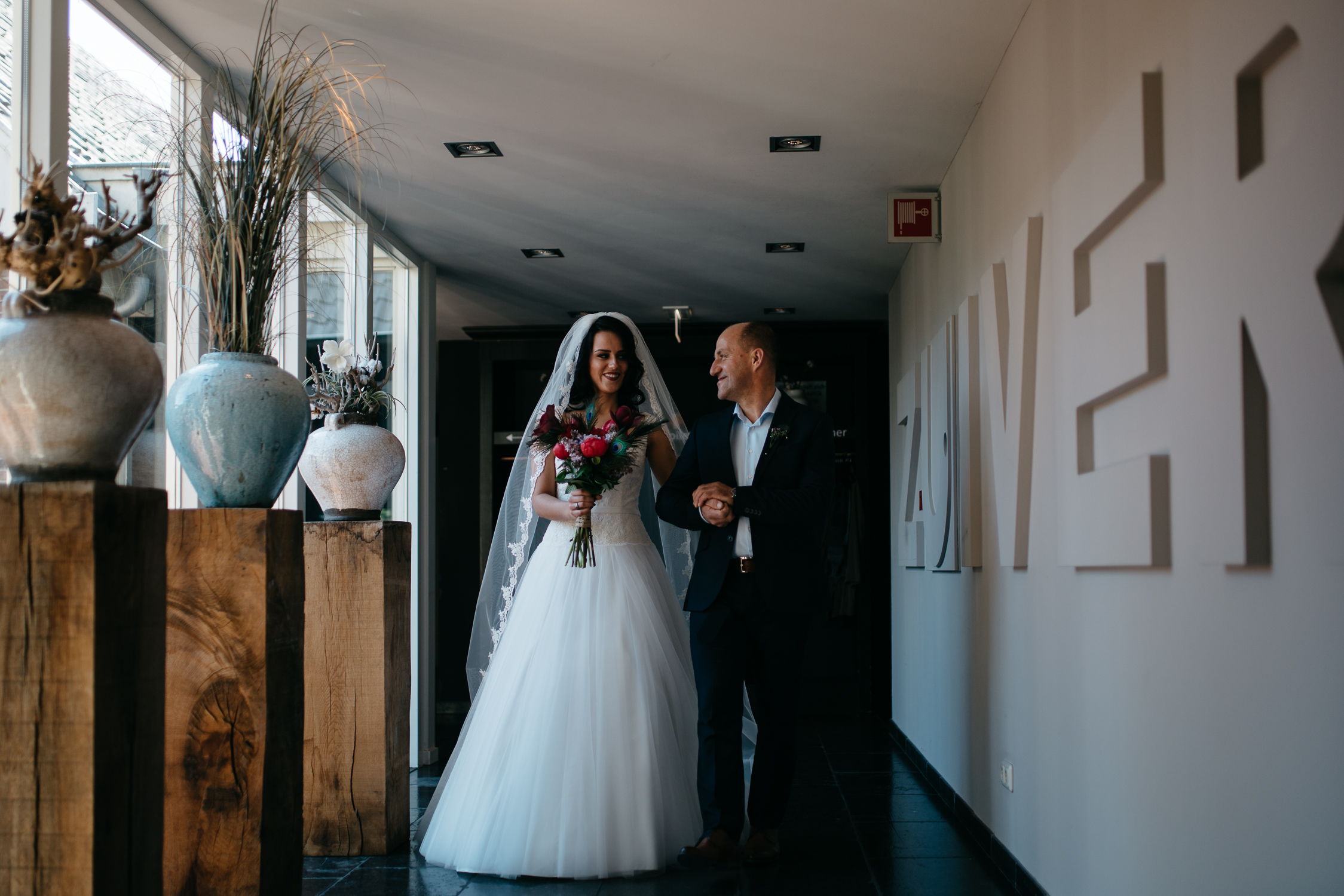 bride walking down isle by wedding photographer mark hadden