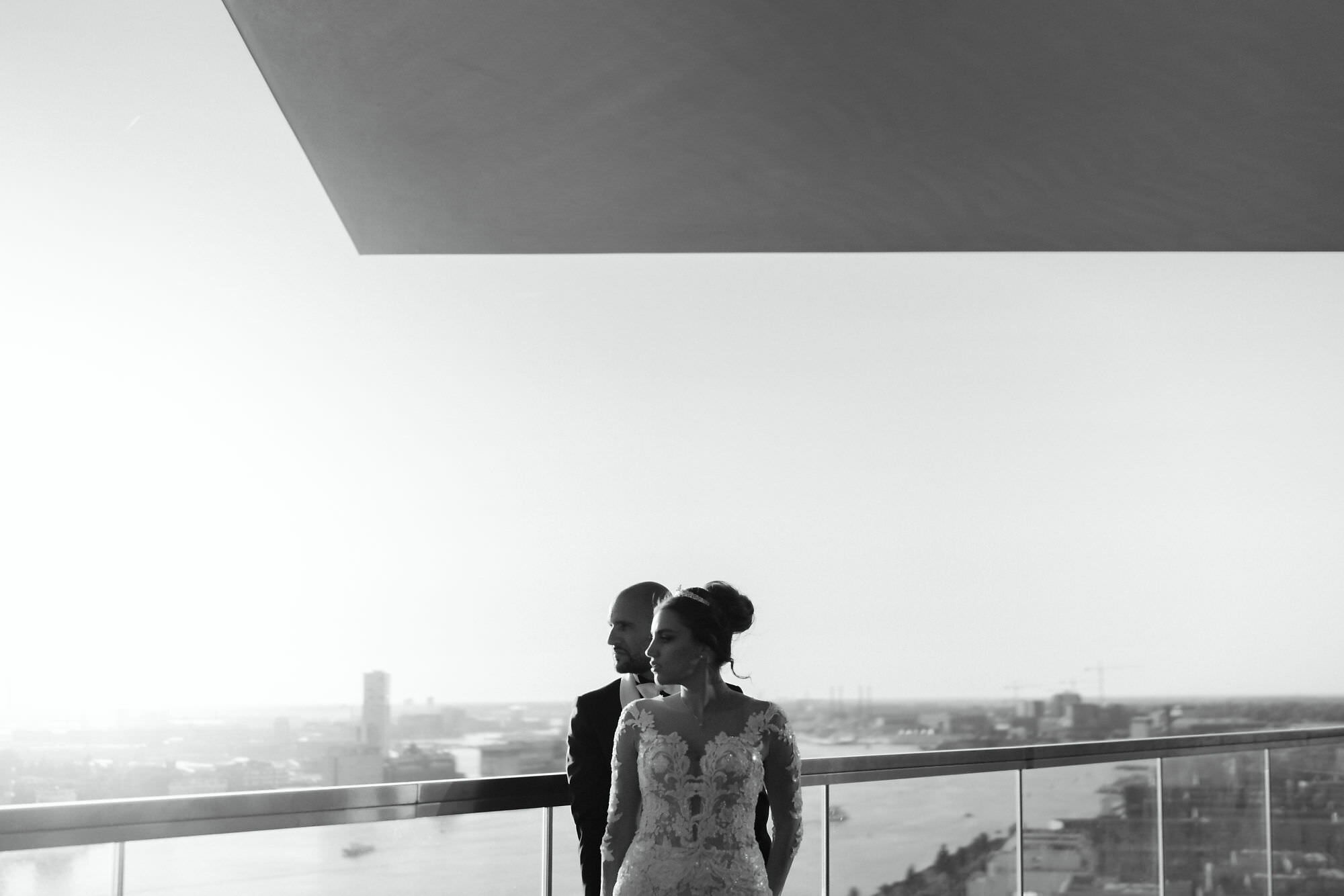 portrait of the wedding couple on the terrace at adam toren loft by mark hadden amsterdam photographer