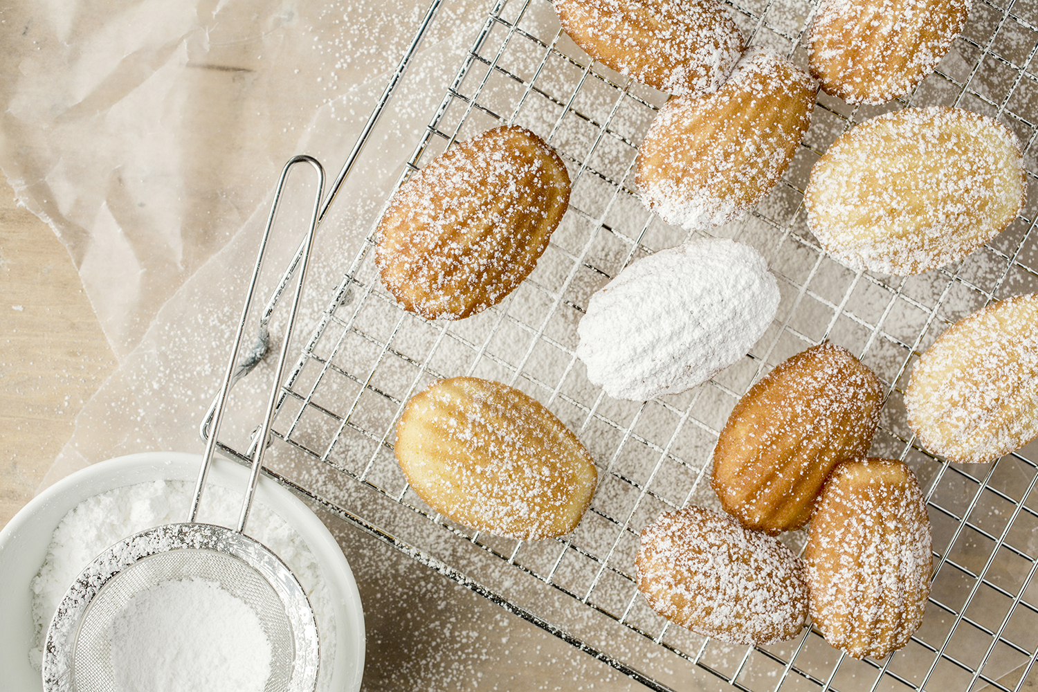 Madeleines dusted with powdered sugar.