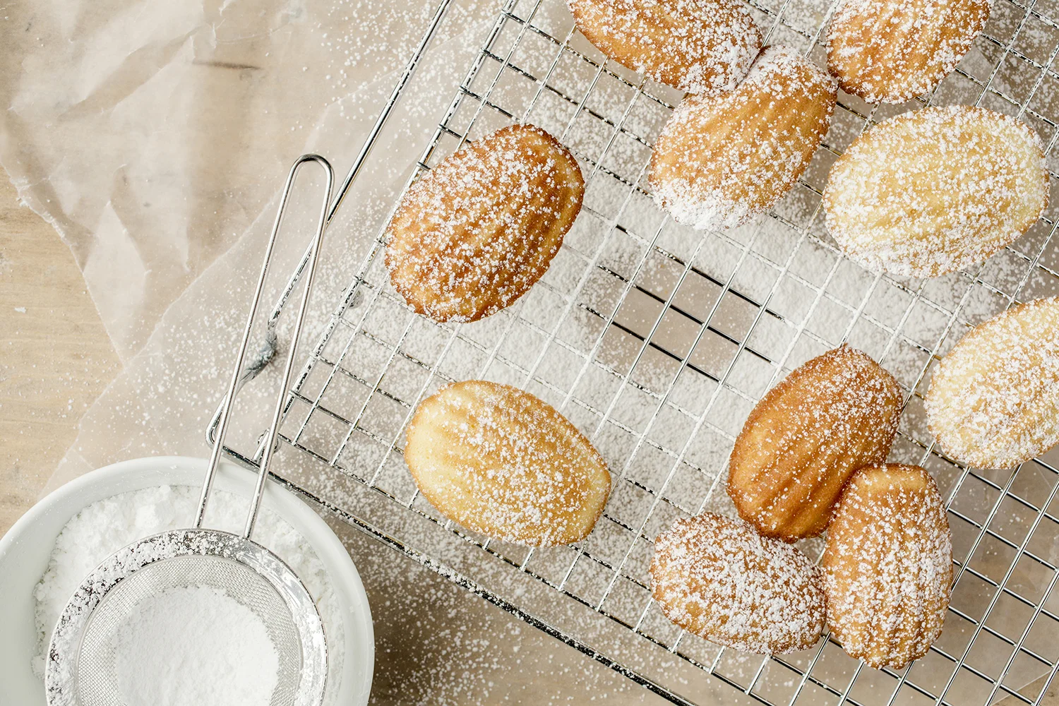 Madeleines dusted with powdered sugar....minus one.