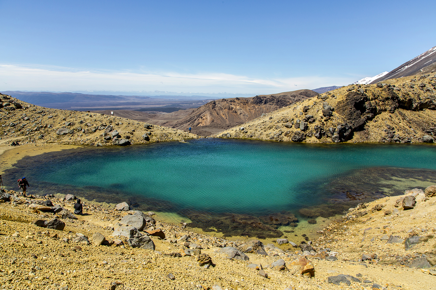 Special to the Democrat-Gazette/
Karen E. Segrave
Hikers walk around one of the Emerald Lakes on the Alpine Crossing in Tongariro National Park, New Zealand.
