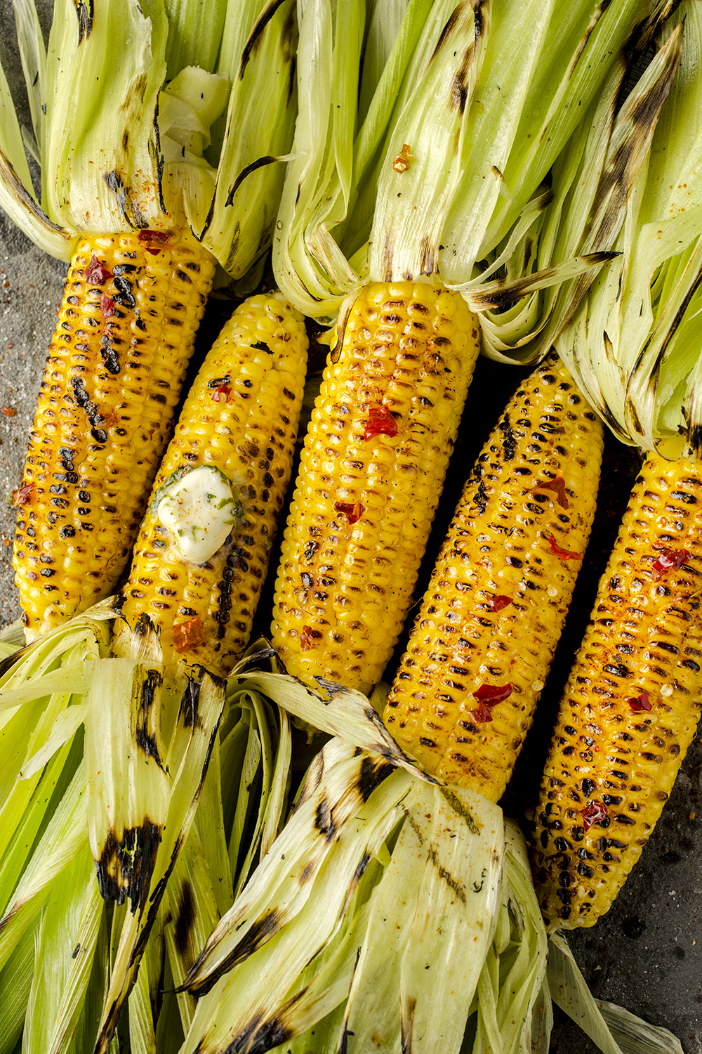 Roasted corn with red pepper and herb butter.