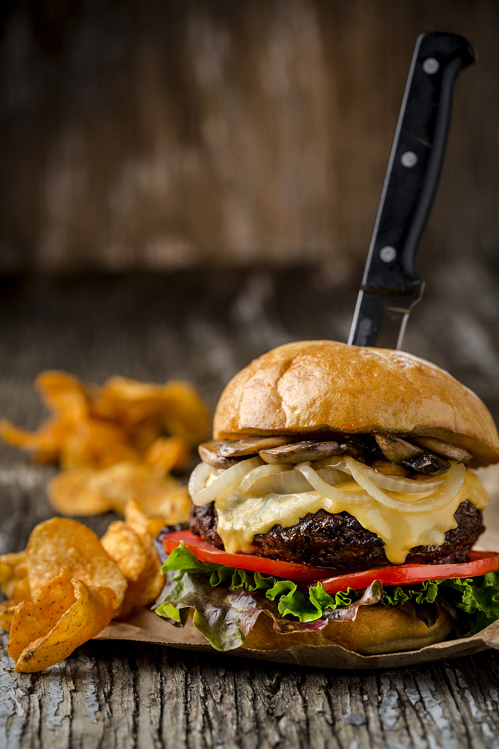 One pound cheeseburger with sauteed mushrooms and caramelized onions. Served with chips.