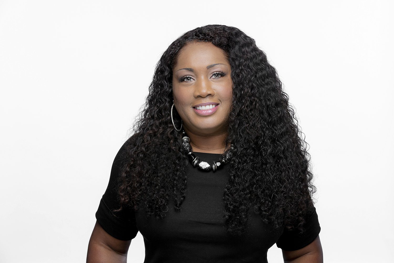 Victoria Martin african american female executive headshot on white seamless.JPG