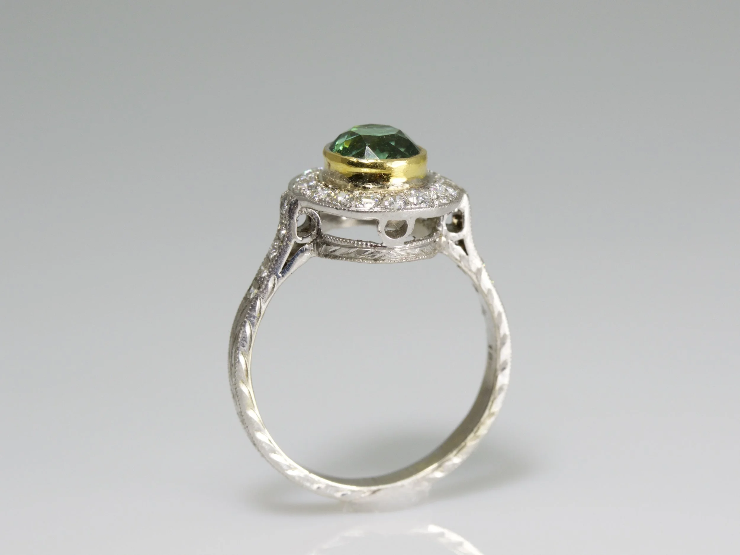 Mixed metal bezel featuring an 18kt gold collar with a platinum band.