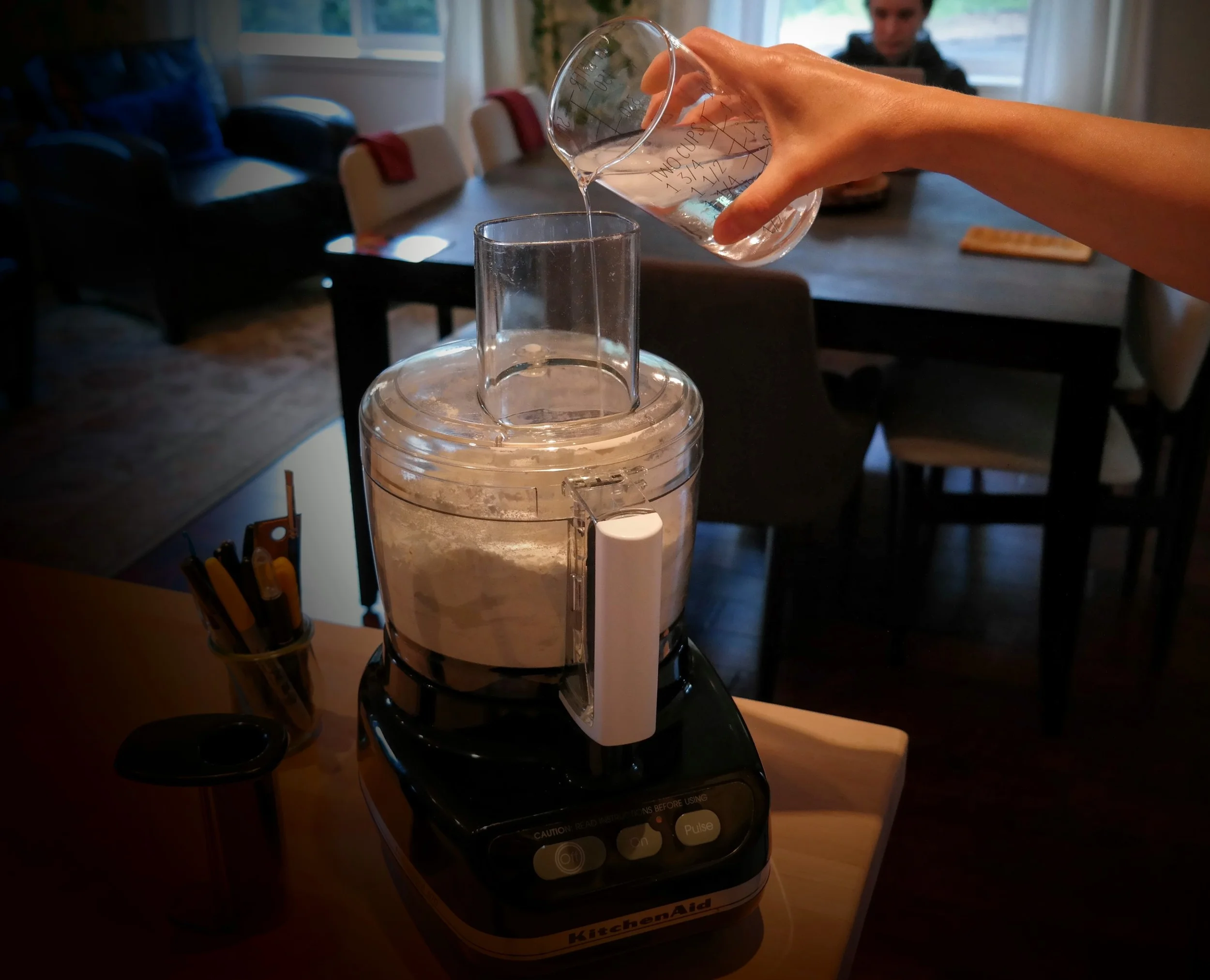 Adding water to the flour, butter and salt