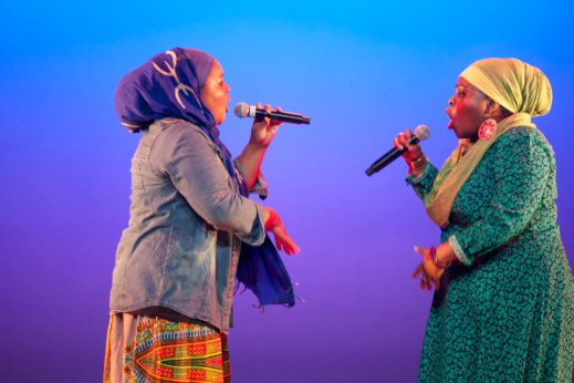 Poetic Pilgrimage performing live on stage.