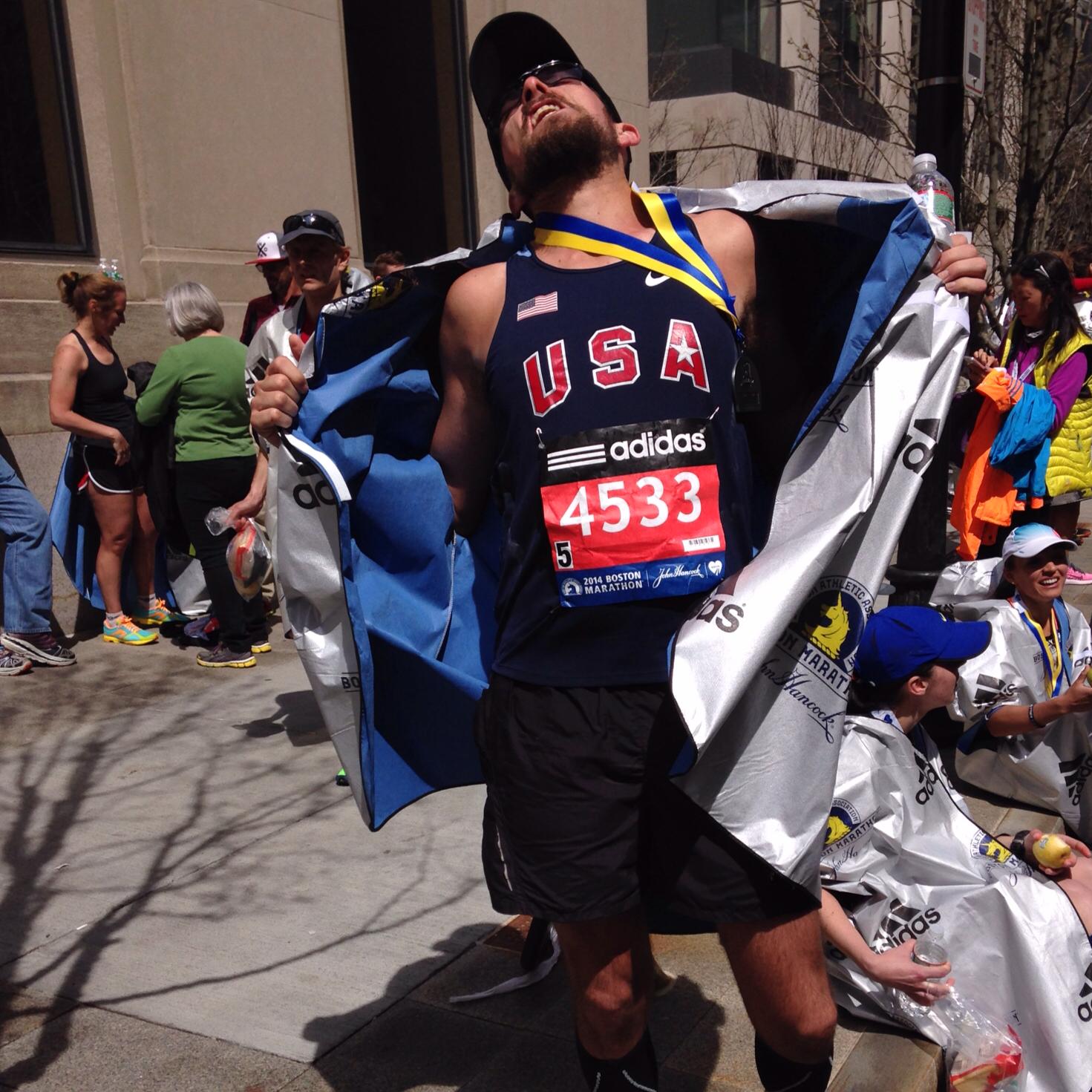 The author in holy rapture at the finish line of the 2014 Boston Marathon. 
