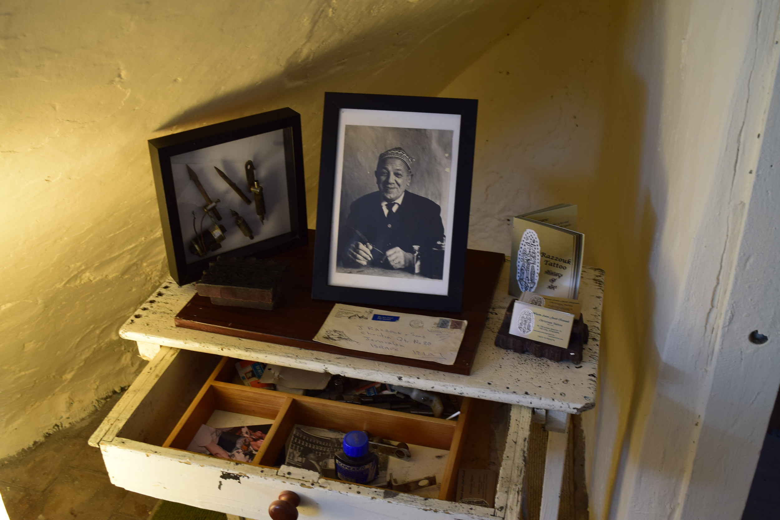 Wassim Razzouk carries on a tradition that is centuries old. Here, his father's tools and work desk are featured with respect in a corner of the current parlor. PHOTO: Ken Chitwood