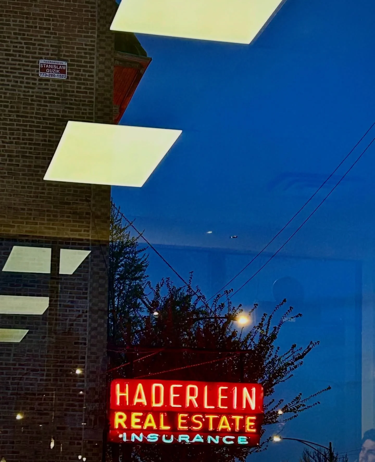 Sidewalk cinema in a liquid glow