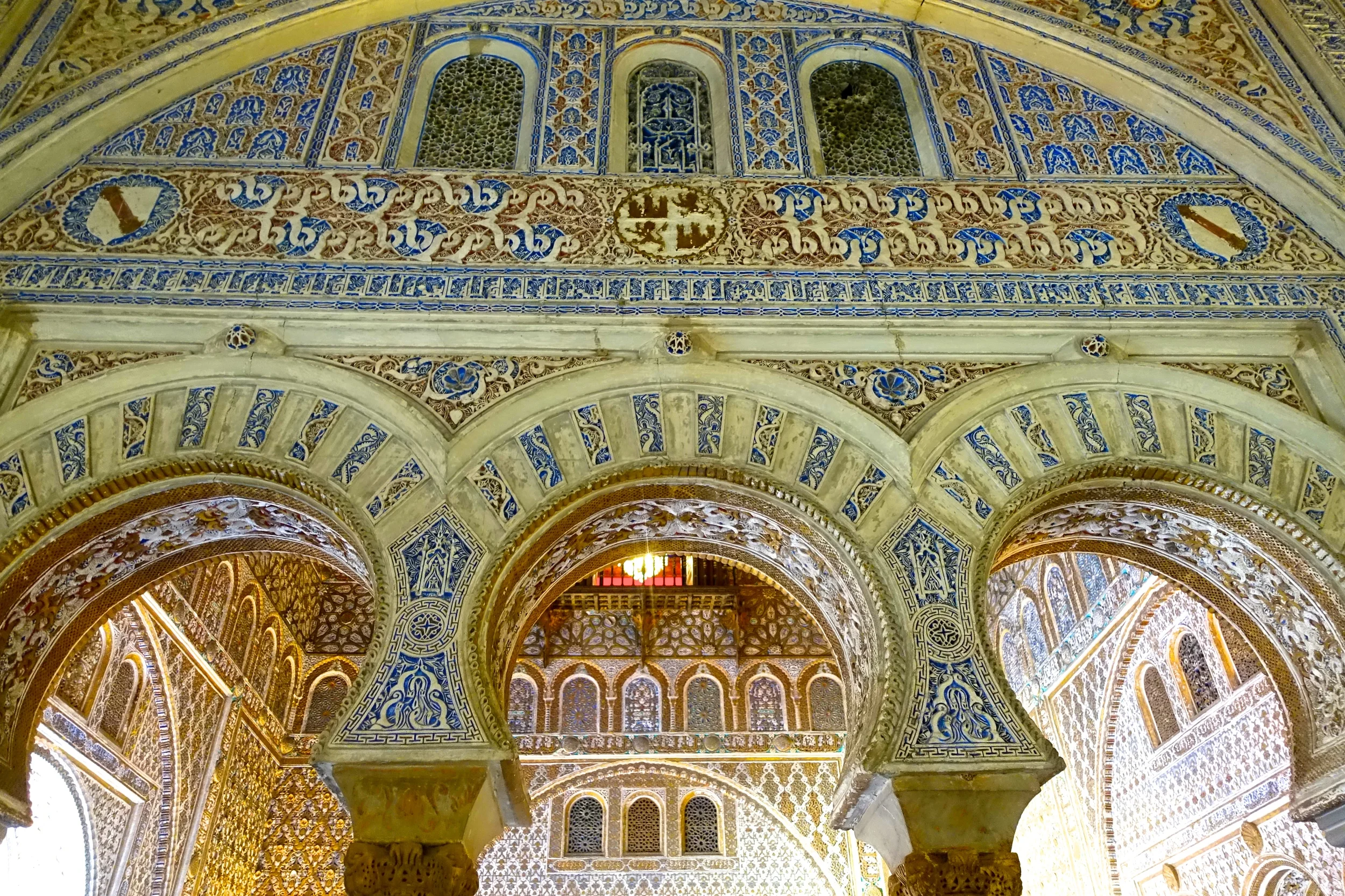 Fun Fact 1: The glowing lights you can see under the middle arch are coming from a chandelier in the King and Queen's quarters. So, when the Spanish royal family takes a trip to Sevilla, they sleep under that chandelier, in this palace... #goals Fun Fact 2: This is the palace of Dorne from season five of Game of Thrones. So cool to see it in use on screen! 