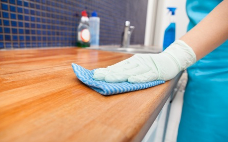 a team member cleaning counter tops