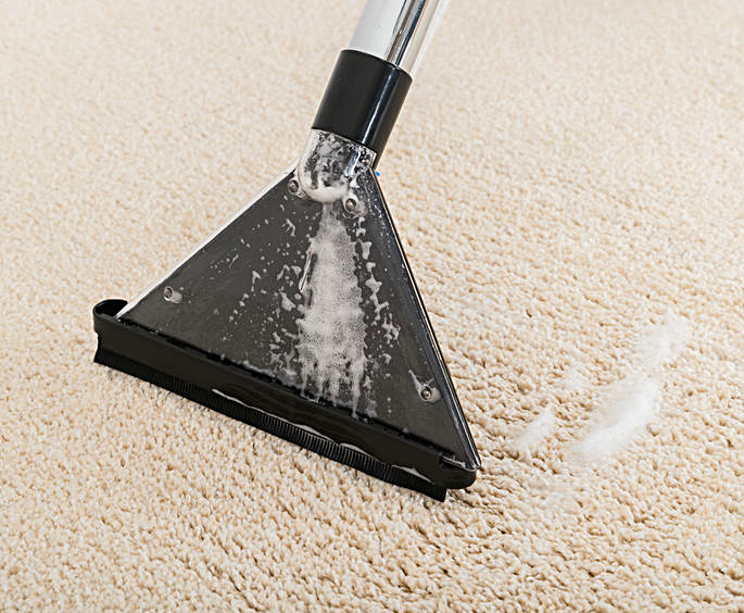 a cleaner on a carpet