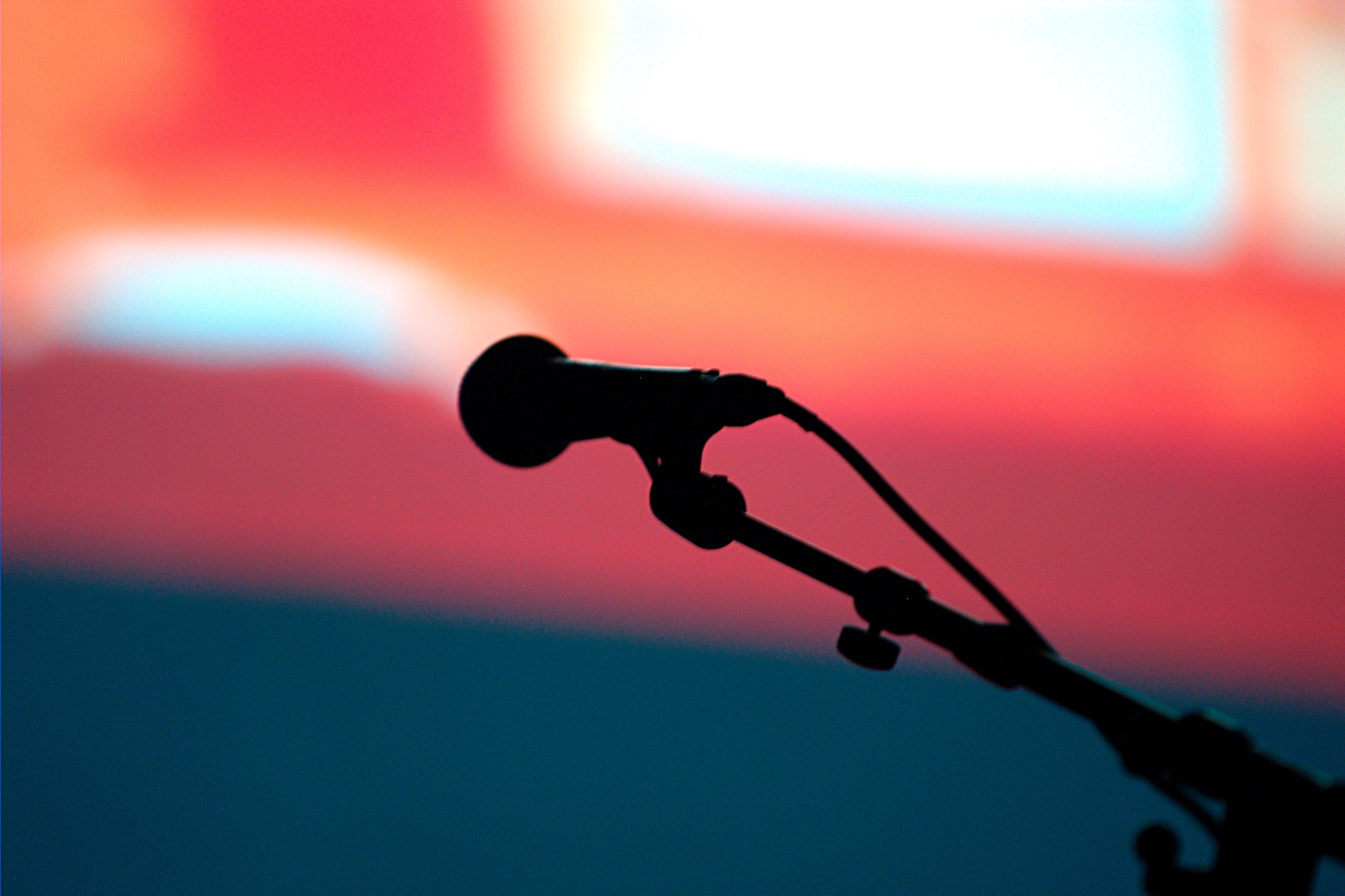 " Open Mic " by Ian Muttoo is licensed under CC BY-SA 2.0 and changed to grayscale from the original.
