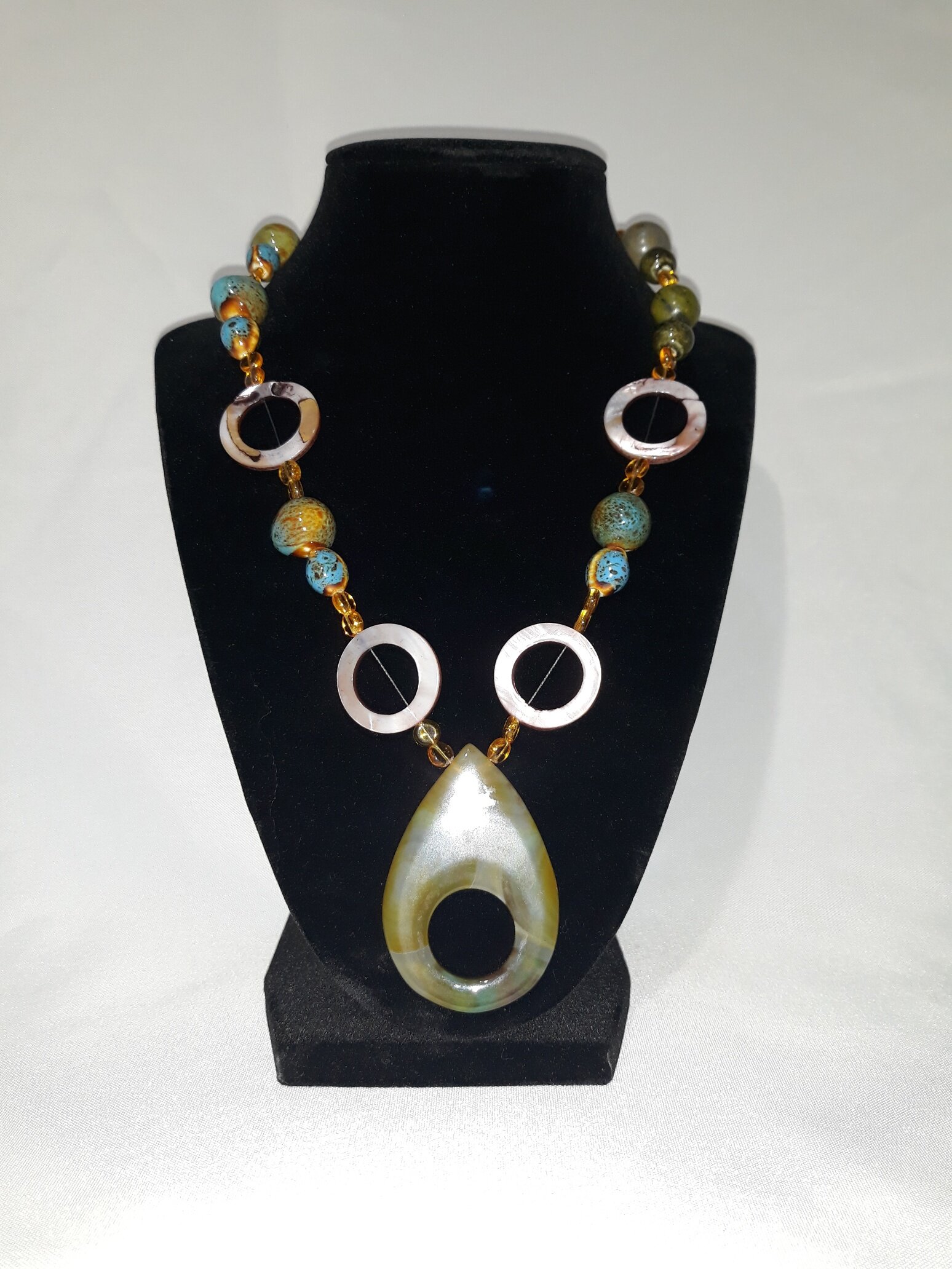 SMC002 Necklace, brown beads w/ okra teardrop pendant