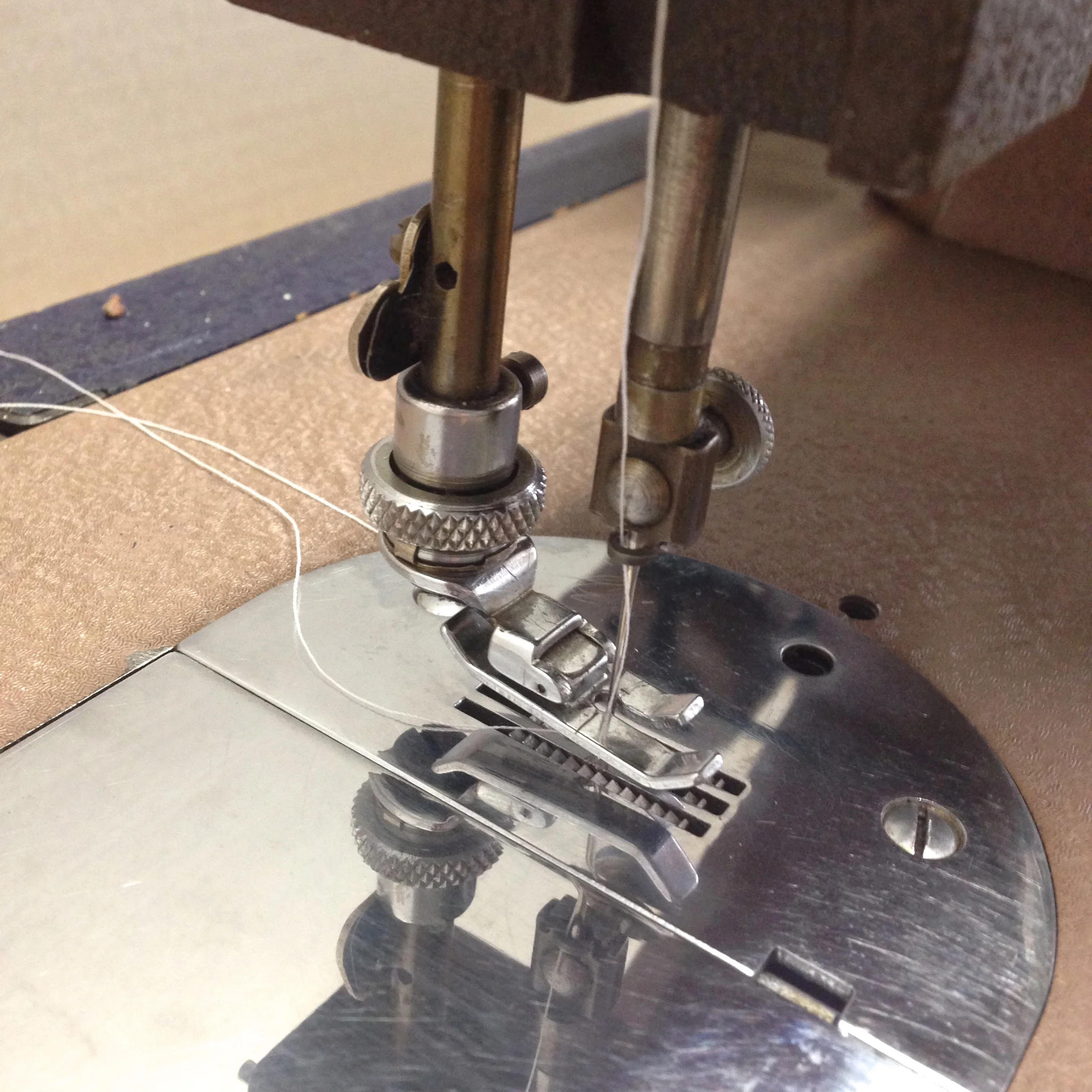 White Rotary straight stitch 4 piece feeder. Saw tooth