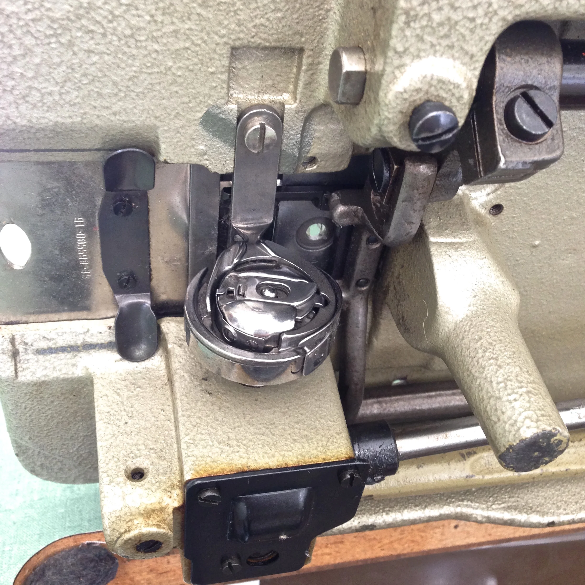 Front loading, vertical, rotary hook.
