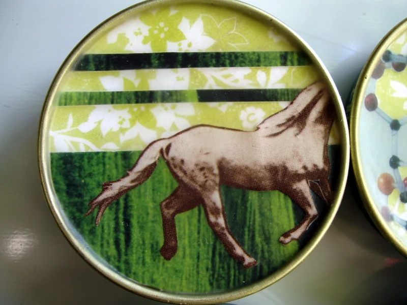 In 2006 and 2007, I recycled the lids of baby food jars by turning them into magnets. Each magnet featured an original collage. I sold them in sets of six in my etsy shop at the time. 
