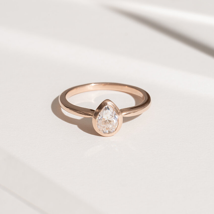 Moissanite and rose gold ring