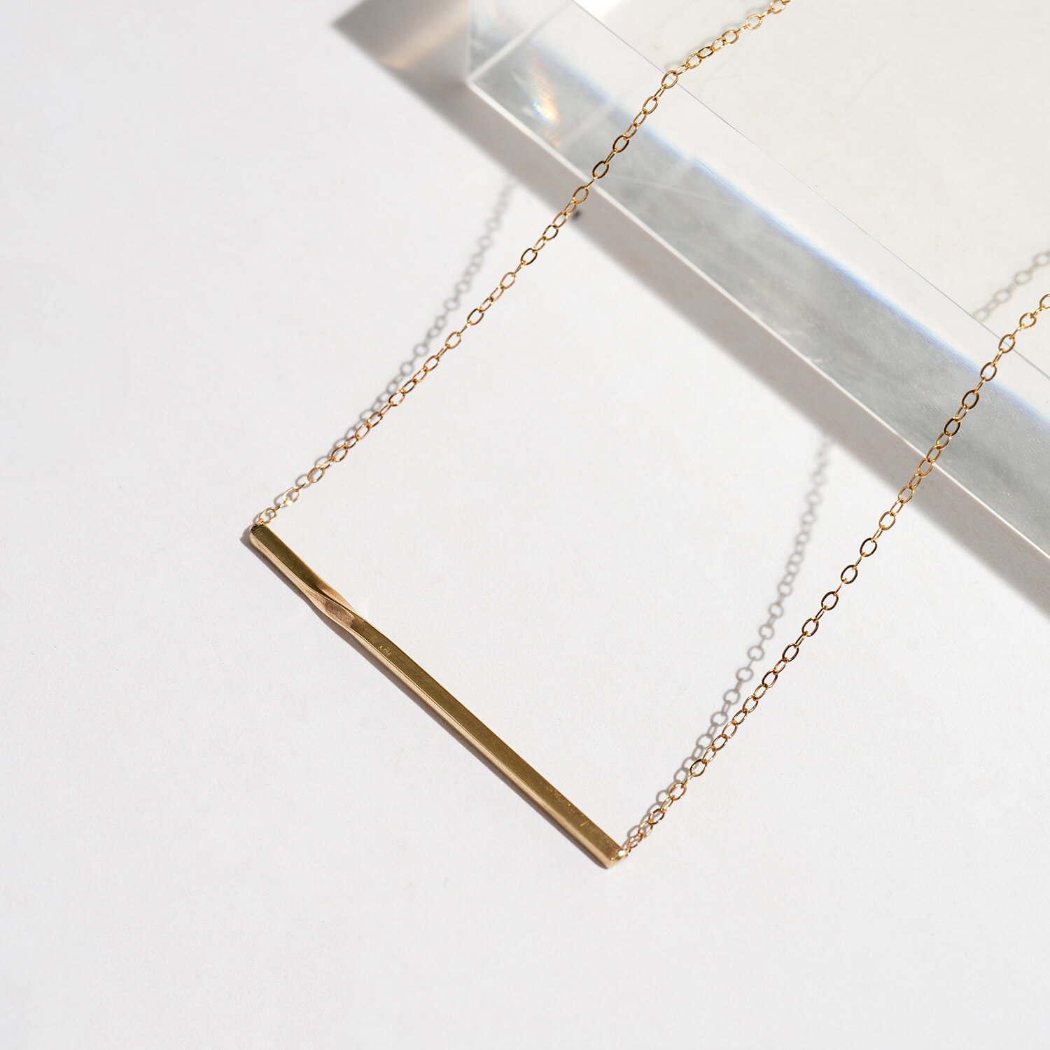 Gold twisted bar necklace 