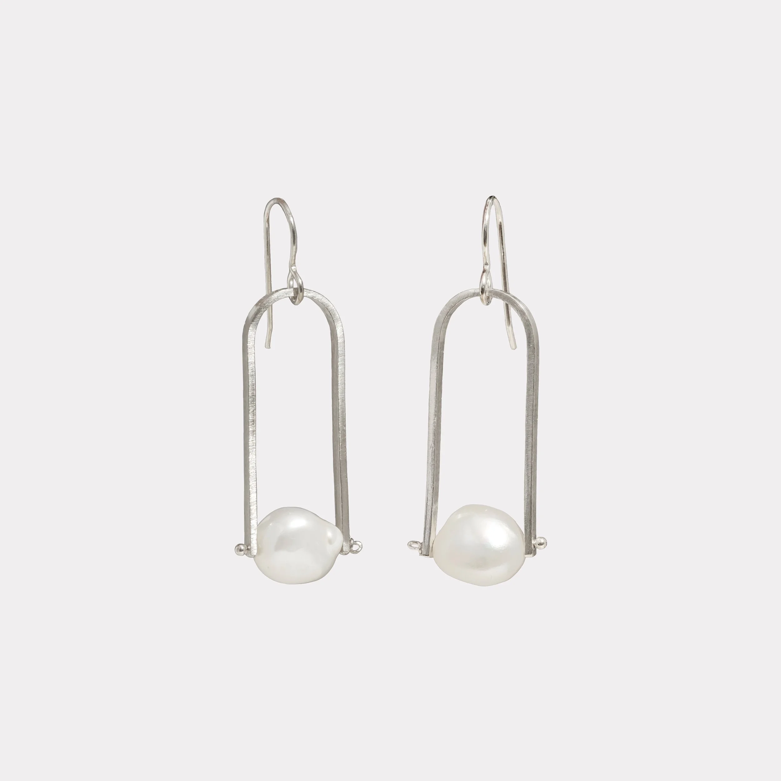 Silver and pearl arch earring