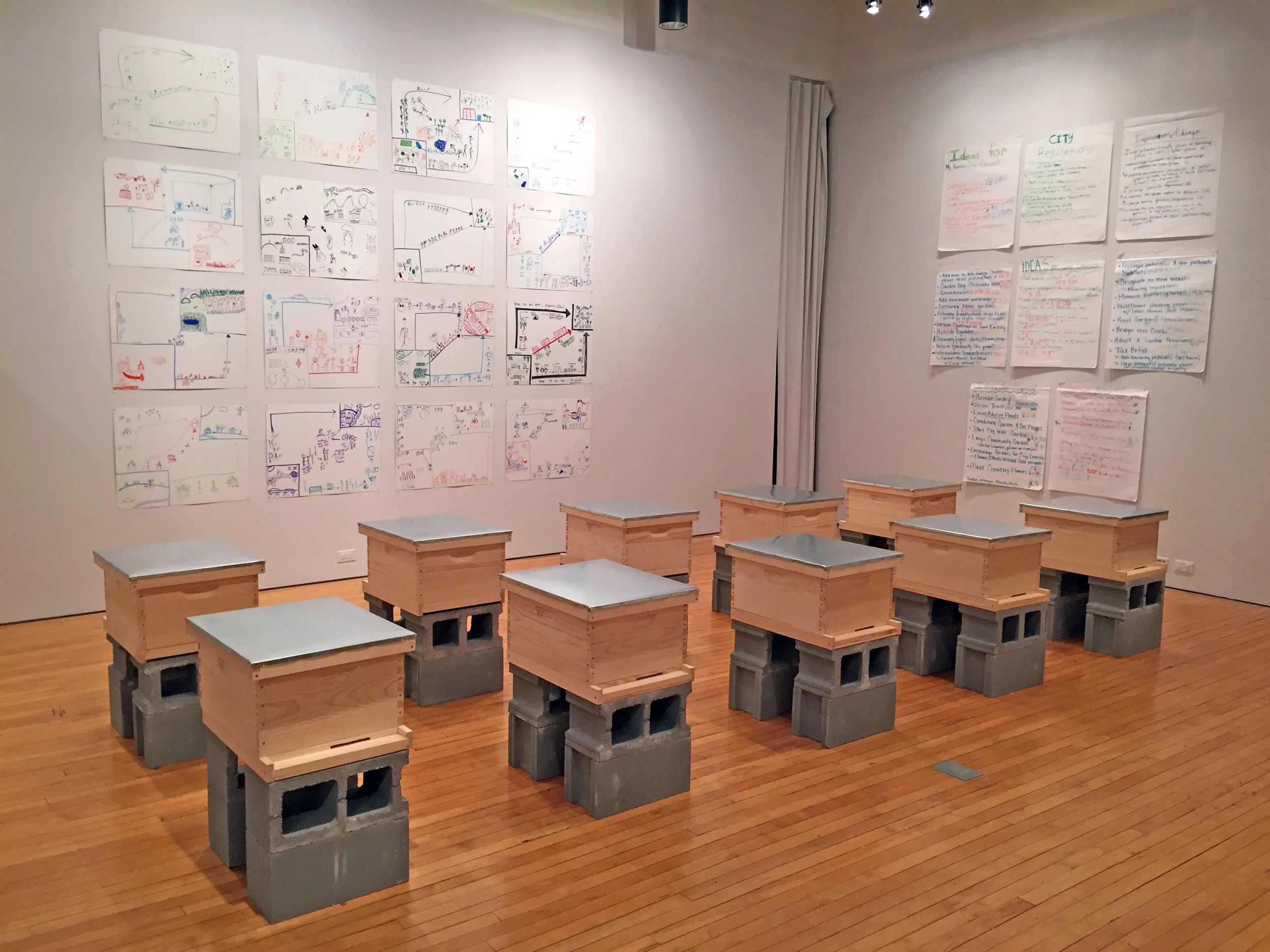 Exhibition of student drawings with installation of hives.