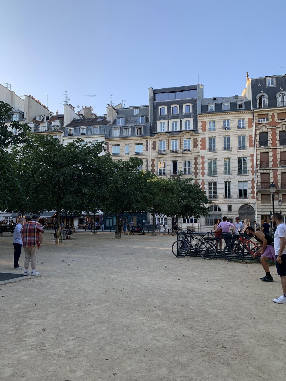 Playing Pétanque at Place Dauphine