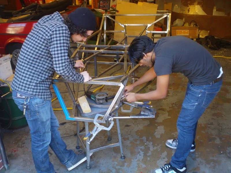 Damian and Adrian are installing the welded A-Arm. Adrian designed the arm and I TIG welded it. Great collaboration.