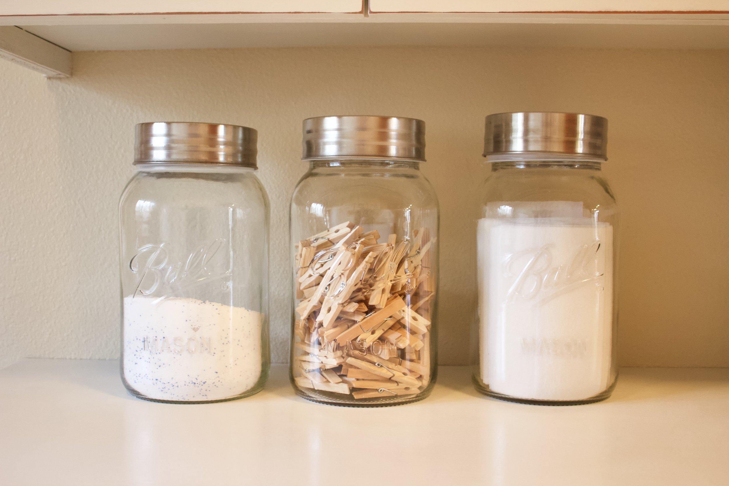 These jars  hold Oxi-Clean, Clothes Pins &amp; Dryer Sheets