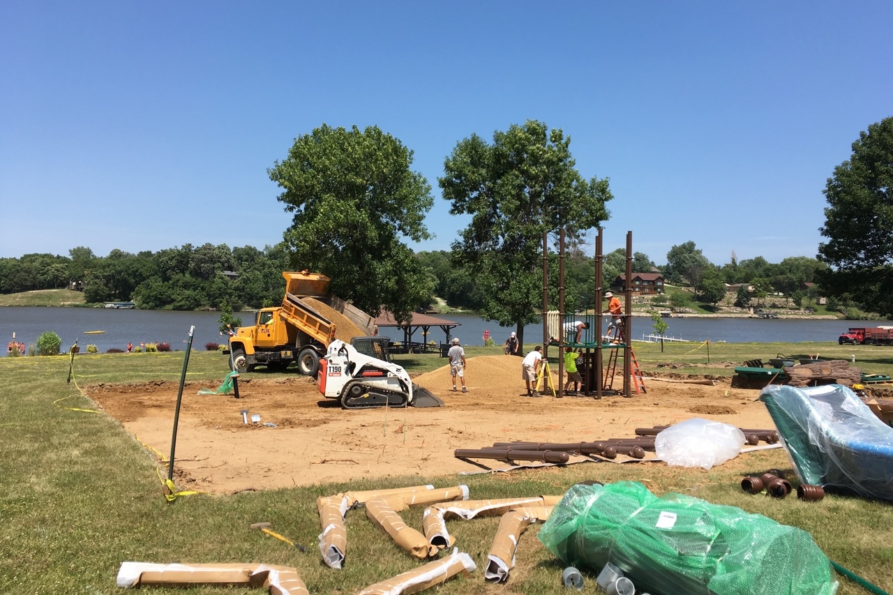 The main tower was the first to be built as playground construction got underway July 11. LPA staff assisted the project by preparing the site, and delivering and spreading pea gravel to form the base.