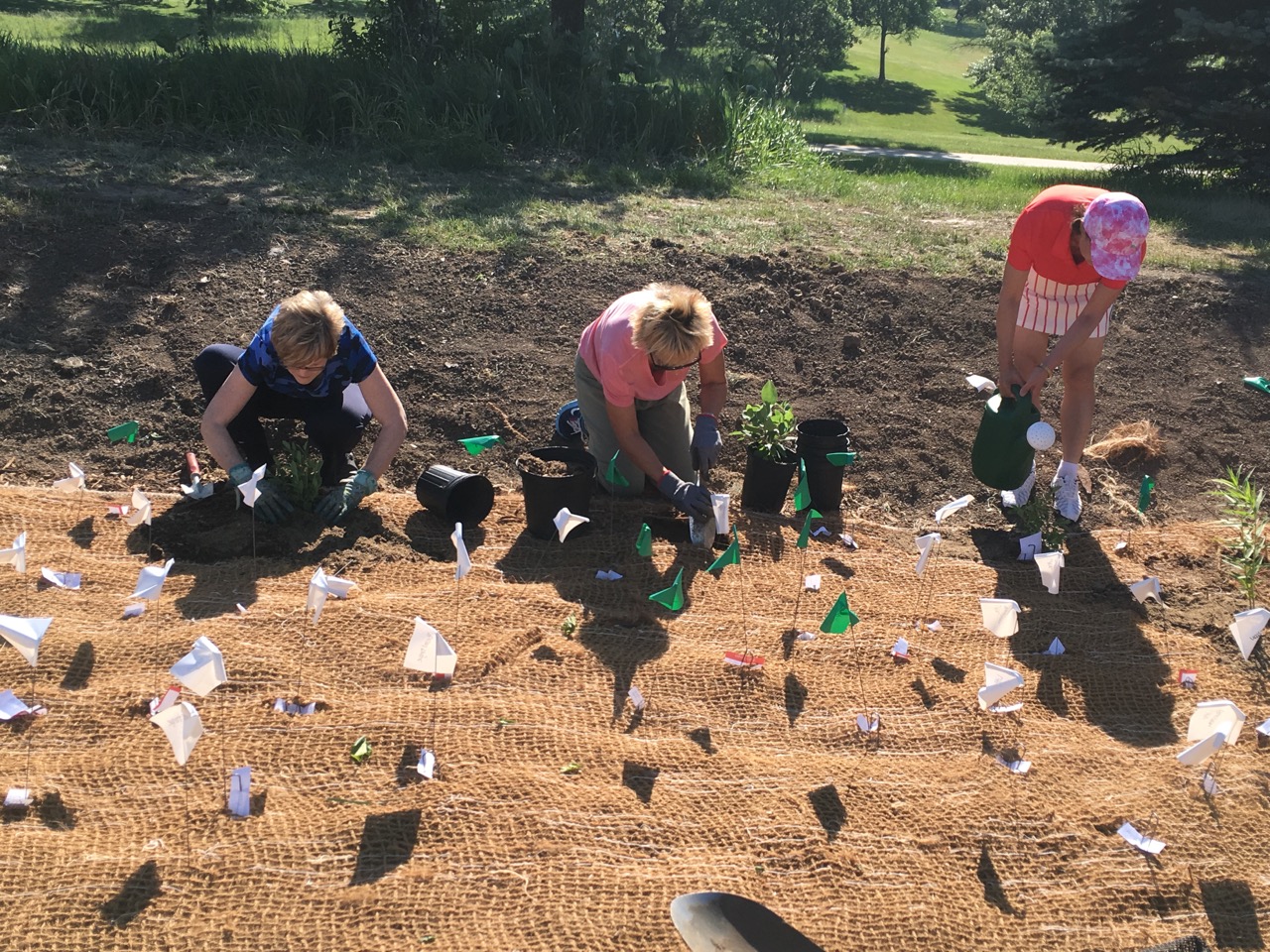 Helping with the rain garden planting, left to right, were Connie Ridgley, Carolyn Hejlik and Ai Dunlop. 
