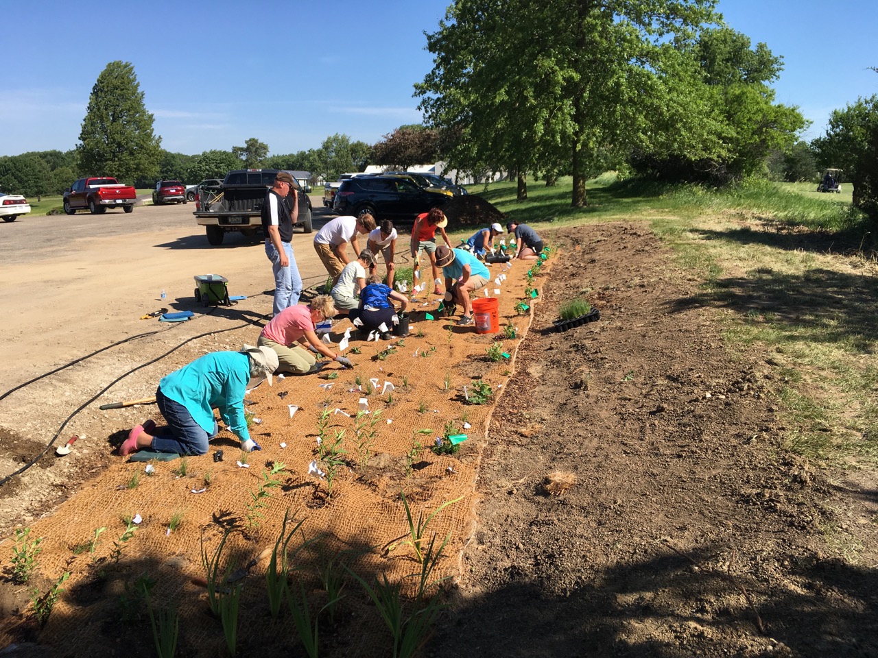 The rain garden will receive water runoff from the east half of the Panorama West parking lot. The plants will absorb some of the water, and the layers of mulch, soil, sand and gravel will slow the water movement. 