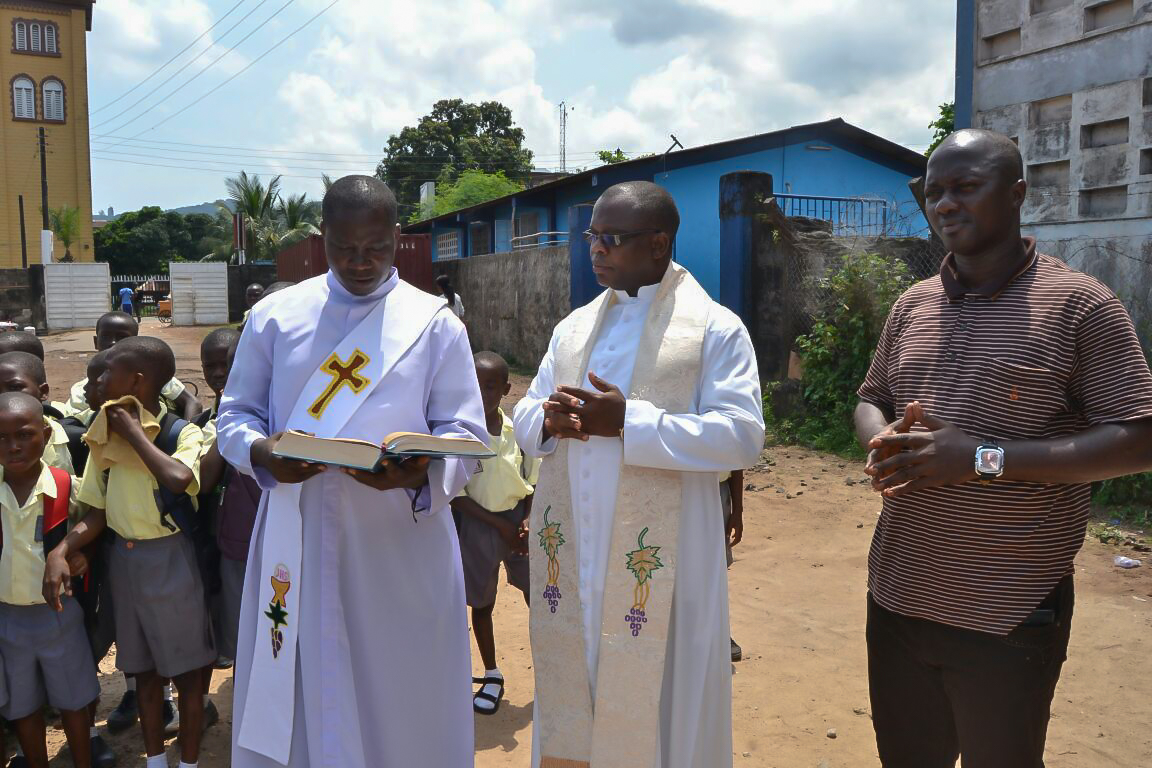 Father Bassey leading dedication ceremony for St. Anthony's Computer Lab