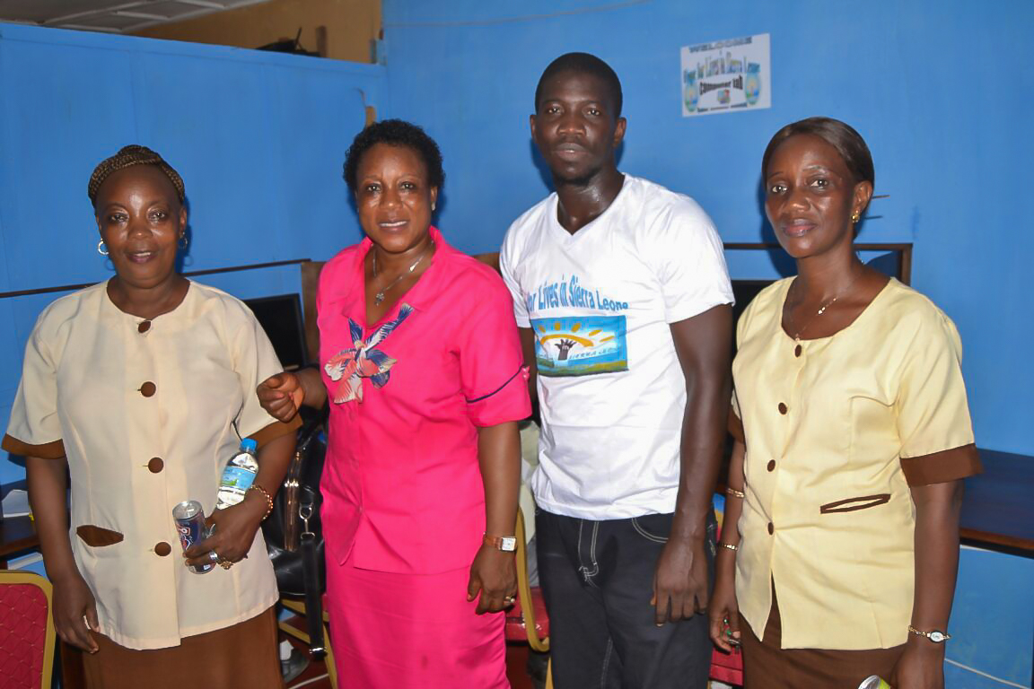 Librarian Mary Tucker and IT manager Kemoh Tarawally w/ 2 teachers