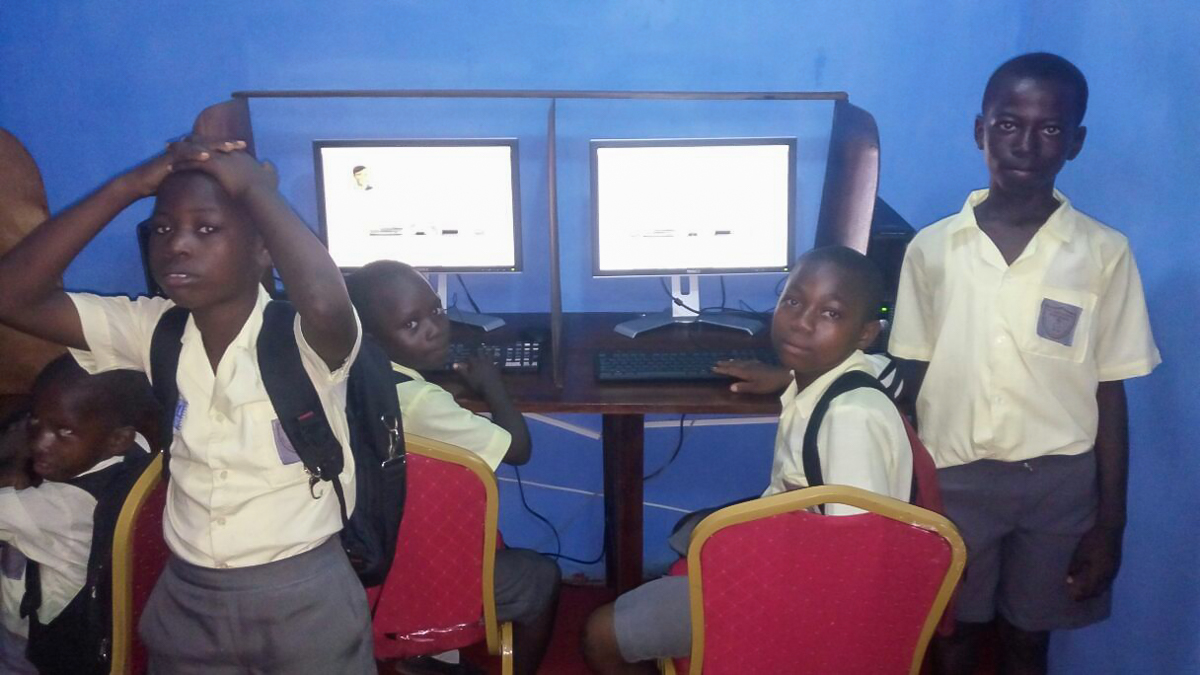 School kids working on computers for the first time
