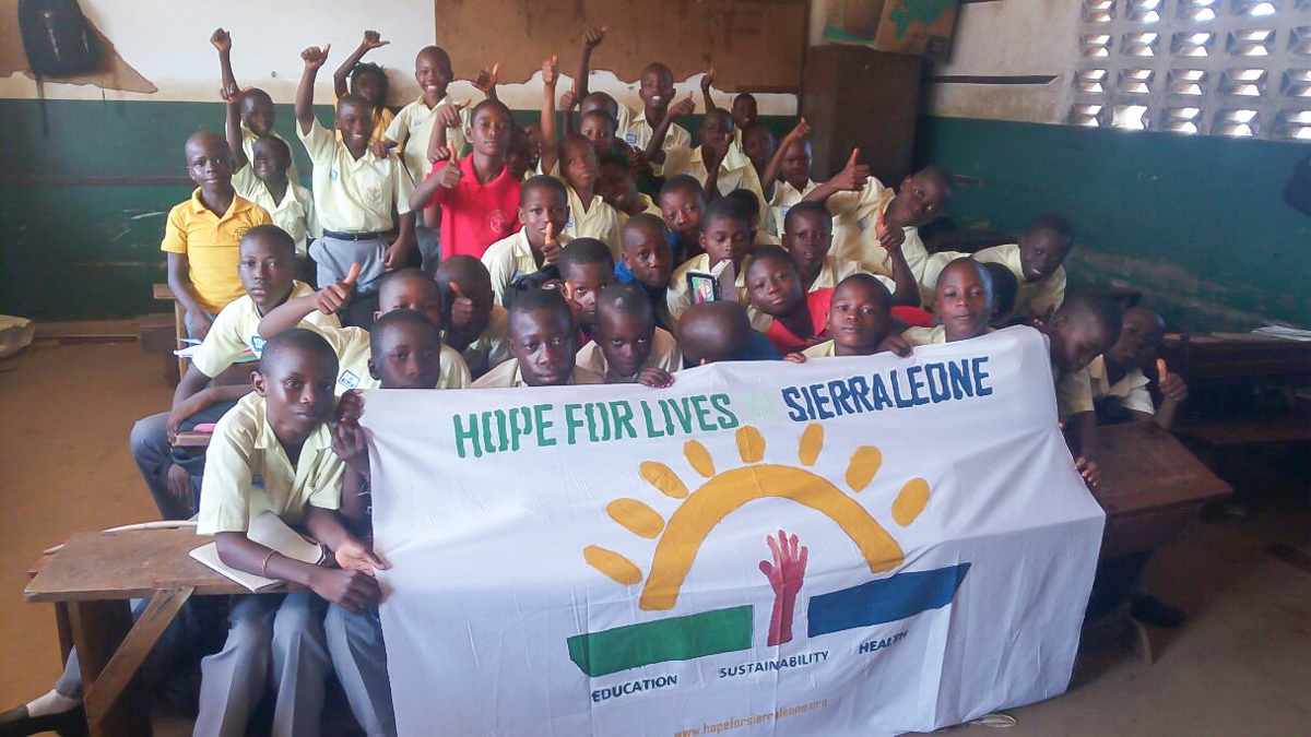 Boys class with their hand painted banner